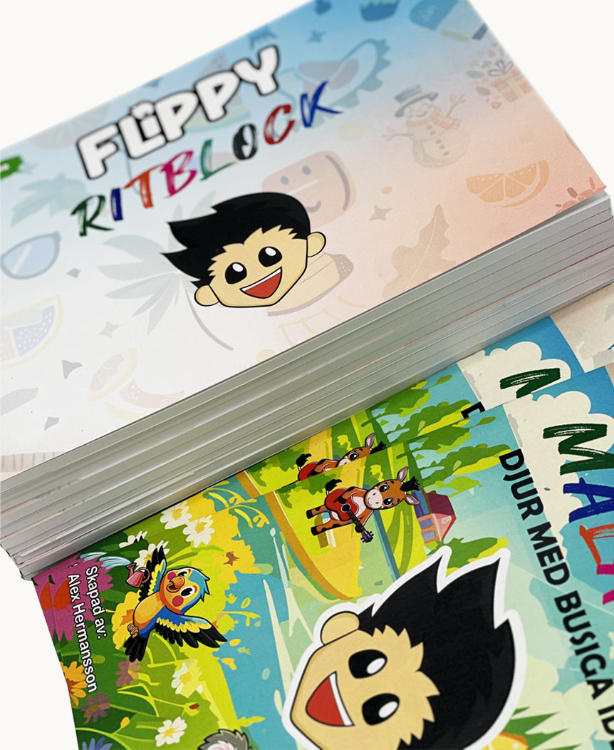 Närbild på Flippys ritblock och målarbok ur Stora Paketet – ett kreativt set som inspirerar till färgläggning, skiss och teckning för alla åldrar.